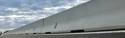 Concrete safety barriers aligned for highway infrastructure projects